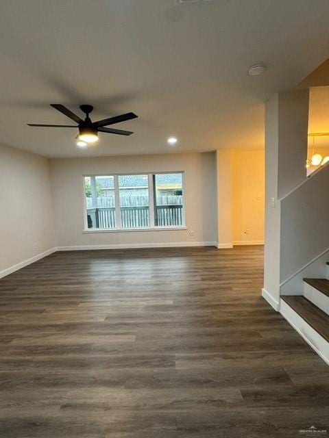 unfurnished room featuring dark hardwood / wood-style floors and ceiling fan