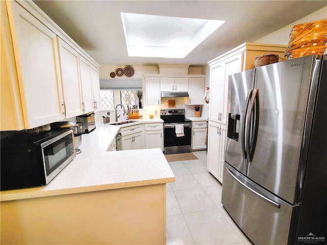 2513 Sandpiper Ave, Mcallen, TX 78504 - kitchen featuring appliances with stainless steel finishes, under cabinet range hood, a sink, light countertops, and light tile patterned floors