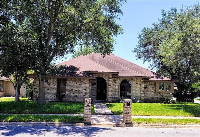 2513 Sandpiper Ave, Mcallen, TX 78504 - view of front of home with brick siding and a front lawn