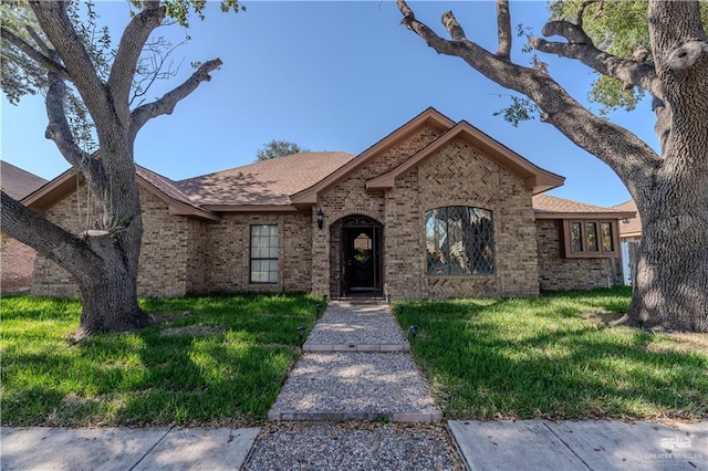 3805 N 1st St, Mcallen, TX 78501 - single story home featuring brick siding and a front lawn