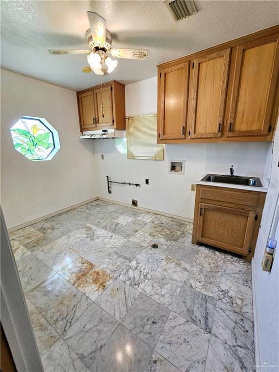 laundry area featuring sink, cabinets, ceiling fan, hookup for a washing machine, and hookup for an electric dryer