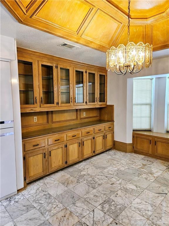 kitchen with hanging light fixtures and a notable chandelier