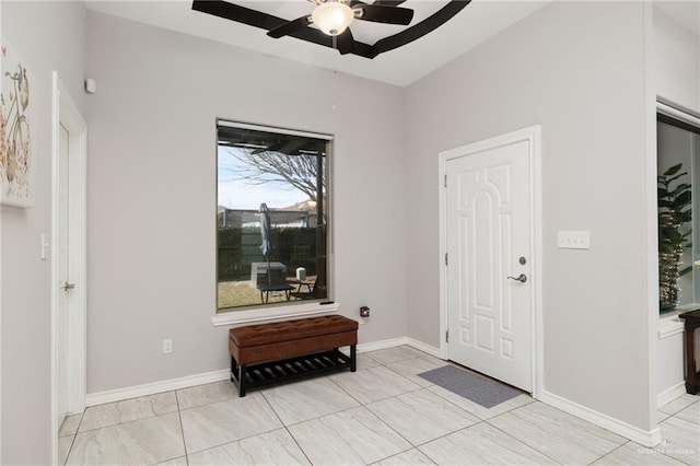 foyer entrance with ceiling fan