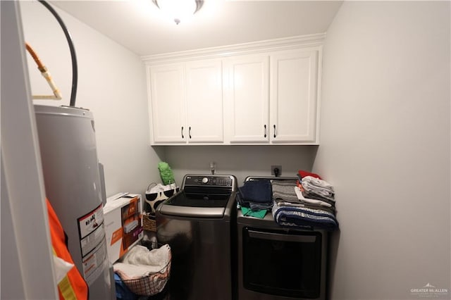 29082 Reynolds Dr, La Feria, TX 78559 - laundry room with water heater, cabinet space, and washer and clothes dryer