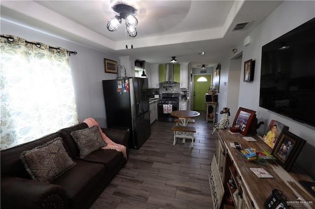 29082 Reynolds Dr, La Feria, TX 78559 - living area with a ceiling fan and a tray ceiling