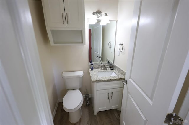 29082 Reynolds Dr, La Feria, TX 78559 - half bath featuring vanity and wood finished floors