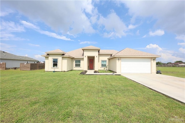 29082 Reynolds Dr, La Feria, TX 78559 - prairie-style home featuring driveway, an attached garage, and stucco siding