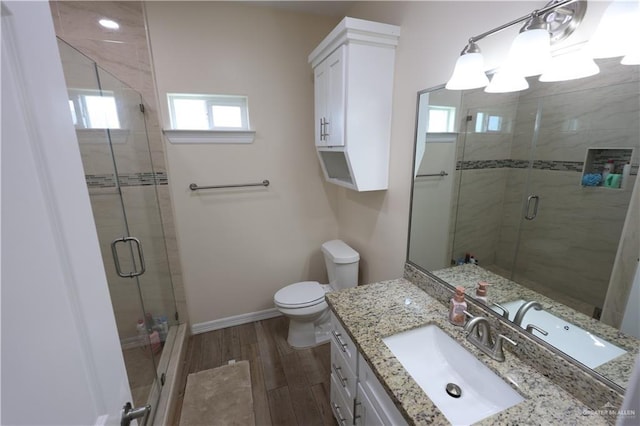 29082 Reynolds Dr, La Feria, TX 78559 - bathroom with vanity, wood finished floors, and a stall shower