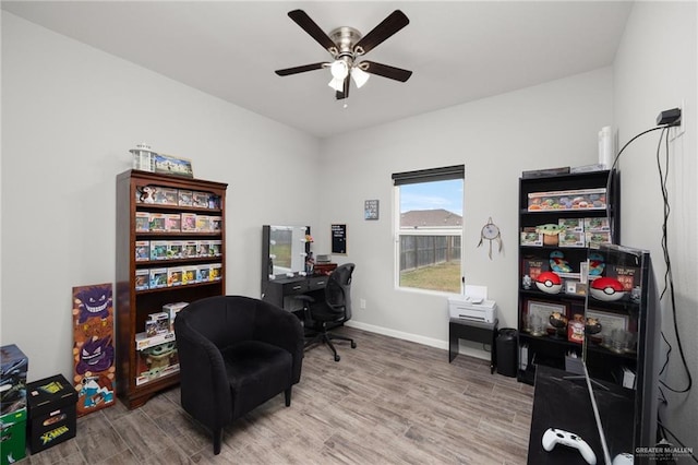 office area with hardwood / wood-style flooring and ceiling fan