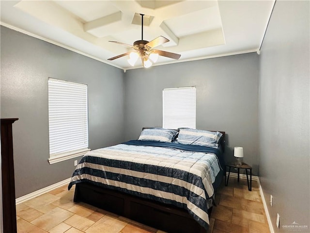 bedroom featuring ceiling fan, ornamental molding, and coffered ceiling