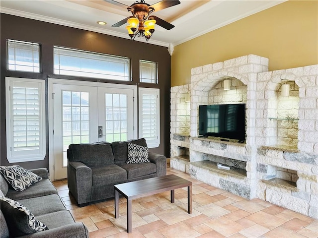 living room featuring ceiling fan, a towering ceiling, crown molding, and french doors