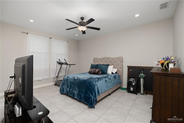 tiled bedroom with ceiling fan