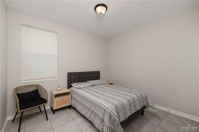 bedroom with light tile patterned floors