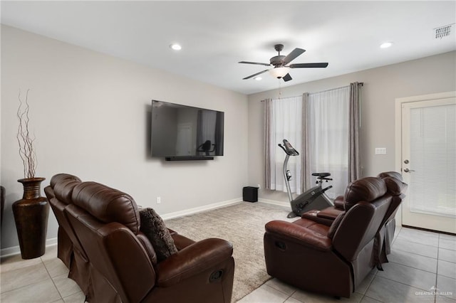 living room featuring ceiling fan and light tile patterned floors