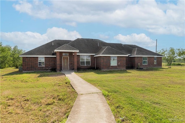 single story home featuring a front yard