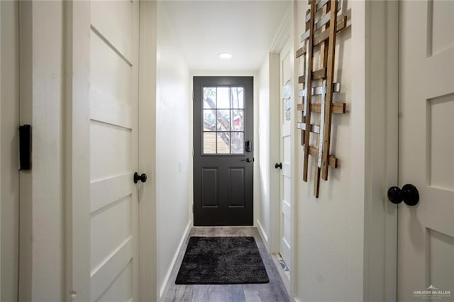 4509 Gardenia Ave, Mcallen, TX 78501 - doorway to outside featuring baseboards and dark wood-style flooring