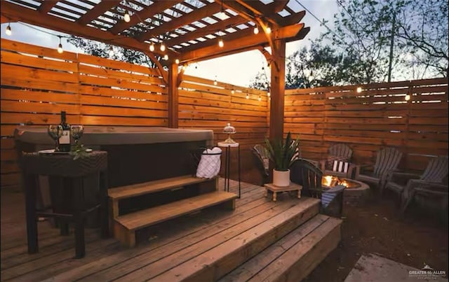 4509 Gardenia Ave, Mcallen, TX 78501 - wooden deck with a hot tub, an outdoor fire pit, and a pergola