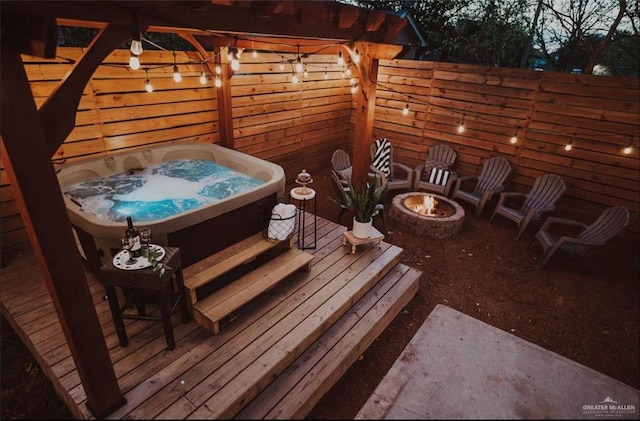 4509 Gardenia Ave, Mcallen, TX 78501 - deck featuring an outdoor hot tub and a fire pit