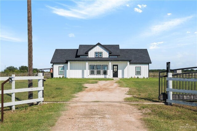 modern farmhouse style home featuring a front yard