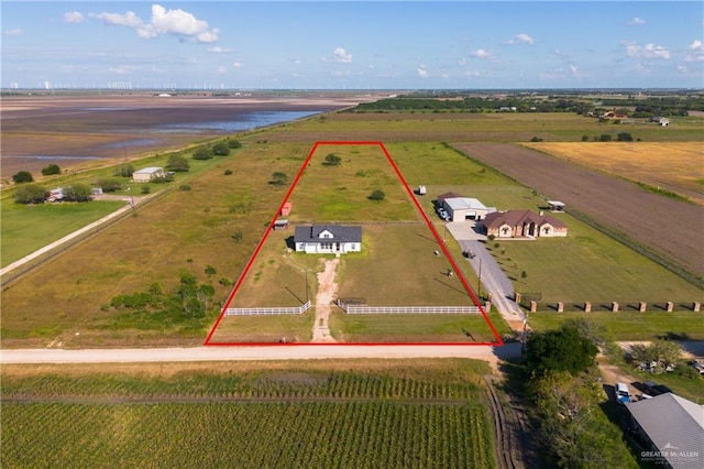 bird's eye view with a rural view and a water view