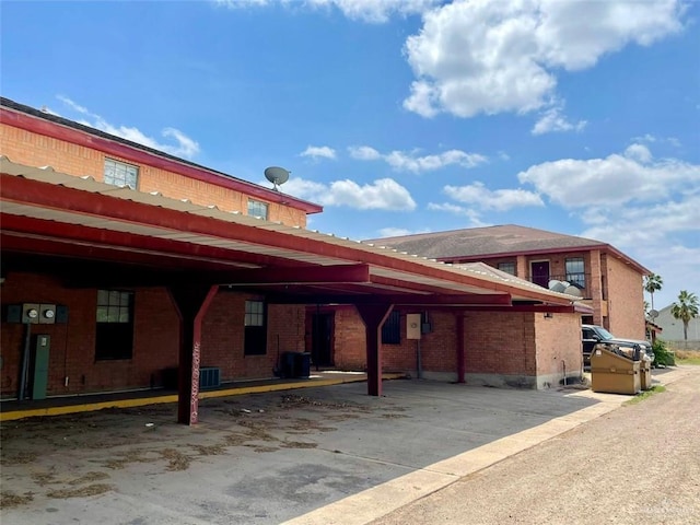 exterior space featuring covered parking and central AC