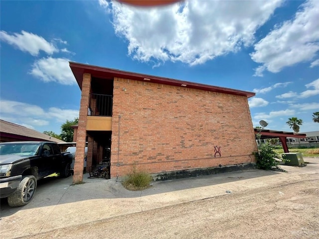 view of side of property with brick siding