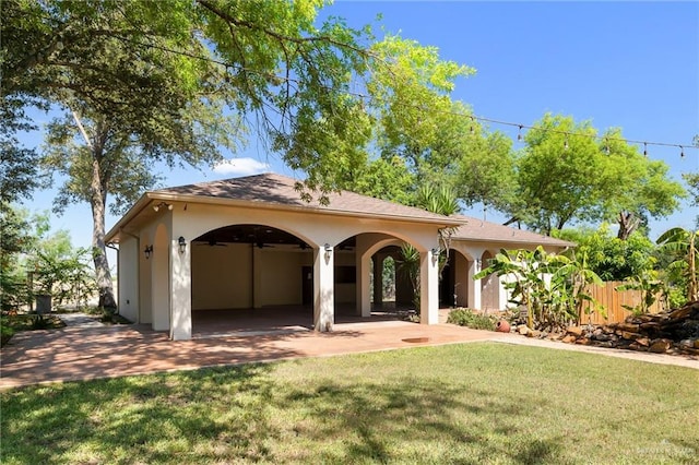 mediterranean / spanish house featuring a front lawn