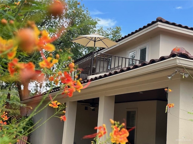 view of side of property featuring a balcony