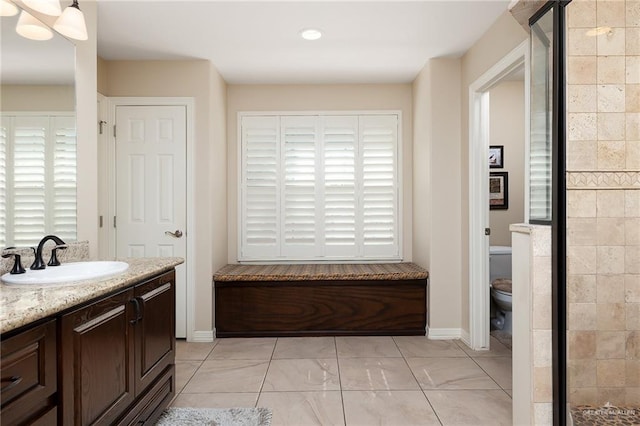 bathroom with vanity and toilet