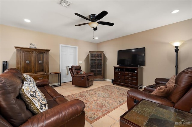 tiled living room with ceiling fan