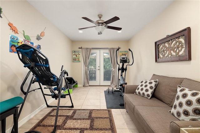 exercise area with ceiling fan, light tile patterned floors, and french doors