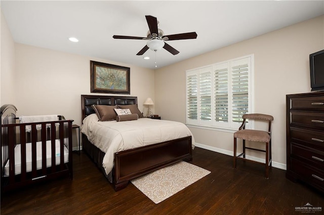 bedroom featuring ceiling fan and dark hardwood / wood-style flooring