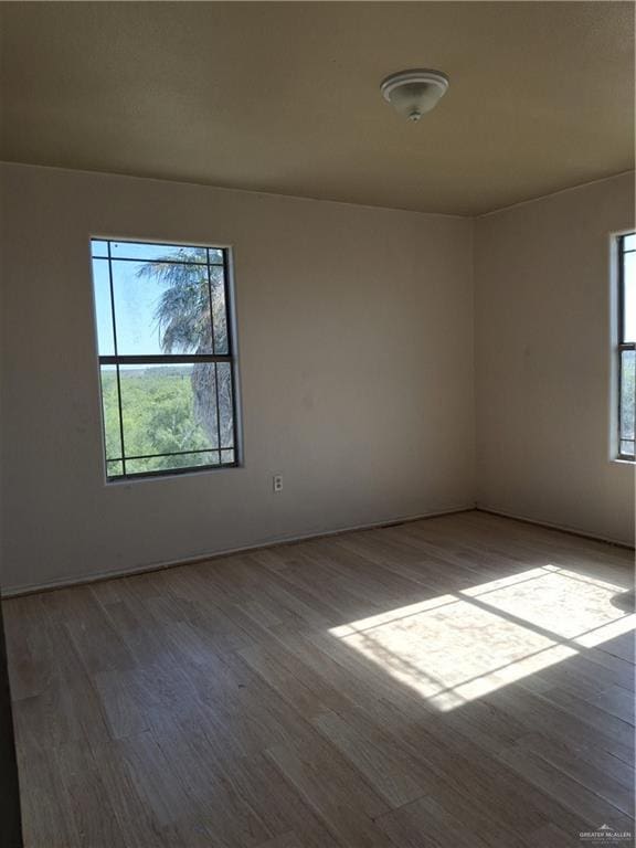 unfurnished room featuring wood finished floors