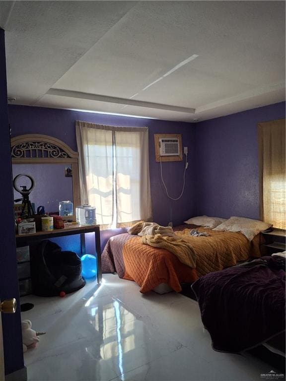 bedroom with a wall mounted air conditioner
