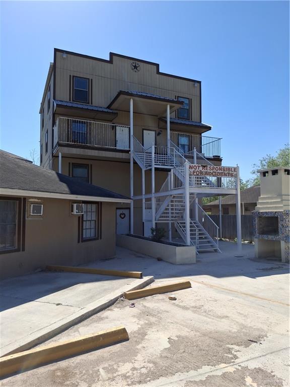 view of property featuring stairs