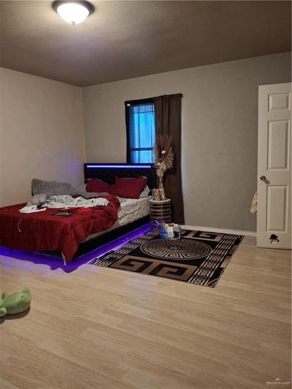 bedroom featuring wood finished floors