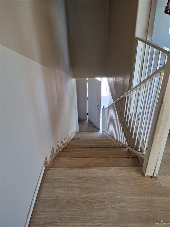 stairs with wood finished floors