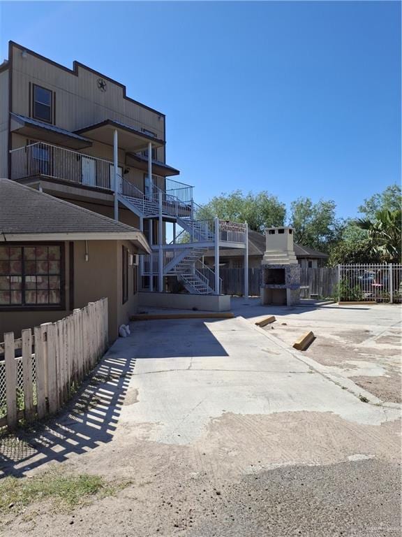 exterior space with concrete driveway