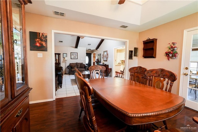 dining area featuring hardwood / wood-style flooring, lofted ceiling with beams, and ceiling fan