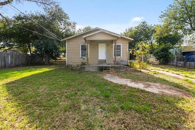 bungalow with a front yard