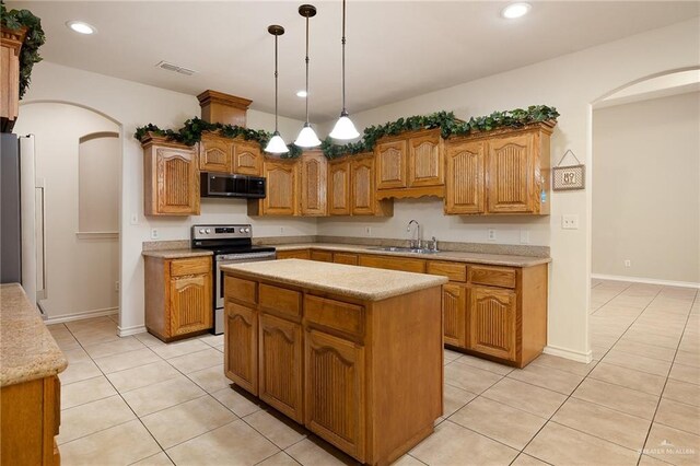 2729 Biltmore Ave, Edinburg, TX 78539 - kitchen featuring electric stove, arched walkways, light tile patterned floors, a sink, and recessed lighting