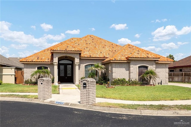 2729 Biltmore Ave, Edinburg, TX 78539 - mediterranean / spanish-style home featuring a tiled roof and french doors