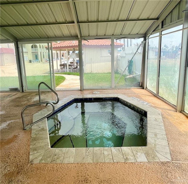 view of swimming pool with an indoor in ground hot tub