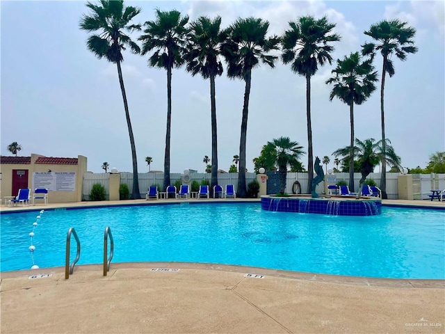 view of swimming pool featuring pool water feature