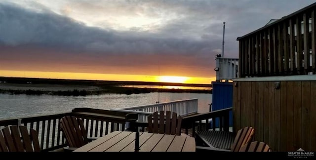 deck at dusk with a water view