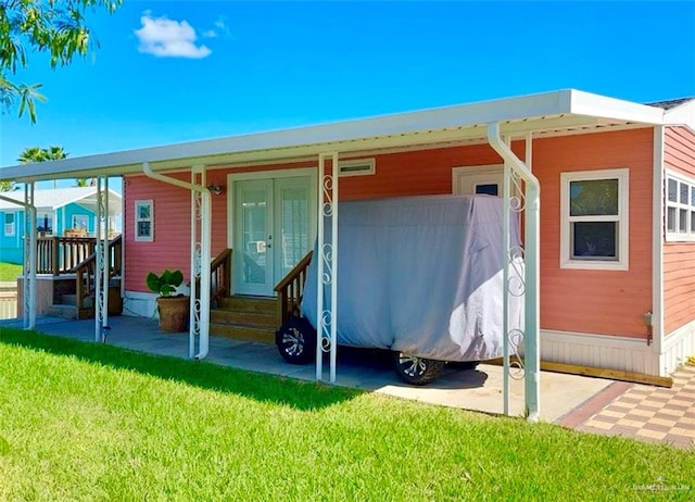 back of house with a yard