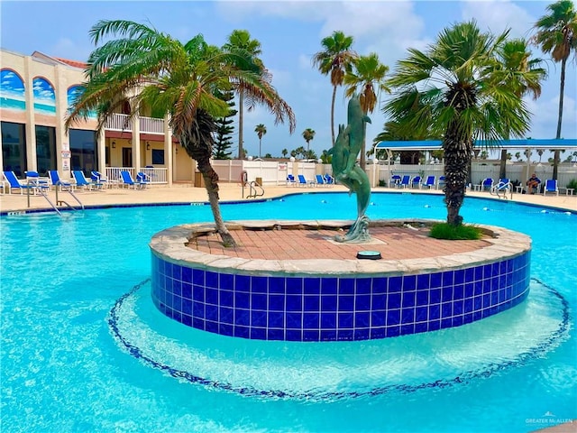 view of swimming pool with a patio area