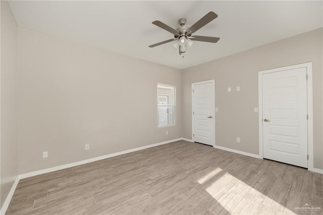 unfurnished bedroom featuring ceiling fan and light wood-type flooring