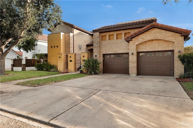 mediterranean / spanish house featuring a garage