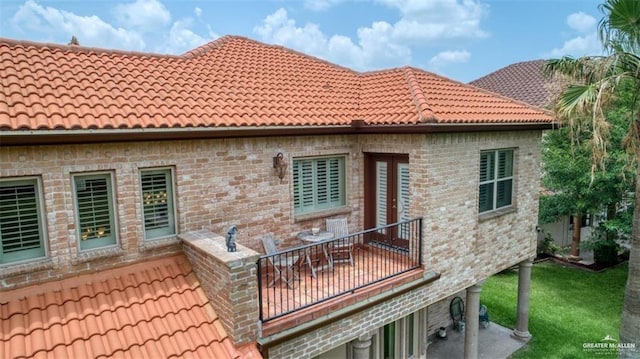 rear view of house with a balcony